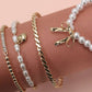 BOW PEARL RHINESTONE BAR STRETCH BANGLE SET