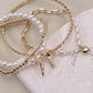 BOW PEARL RHINESTONE BAR STRETCH BANGLE SET